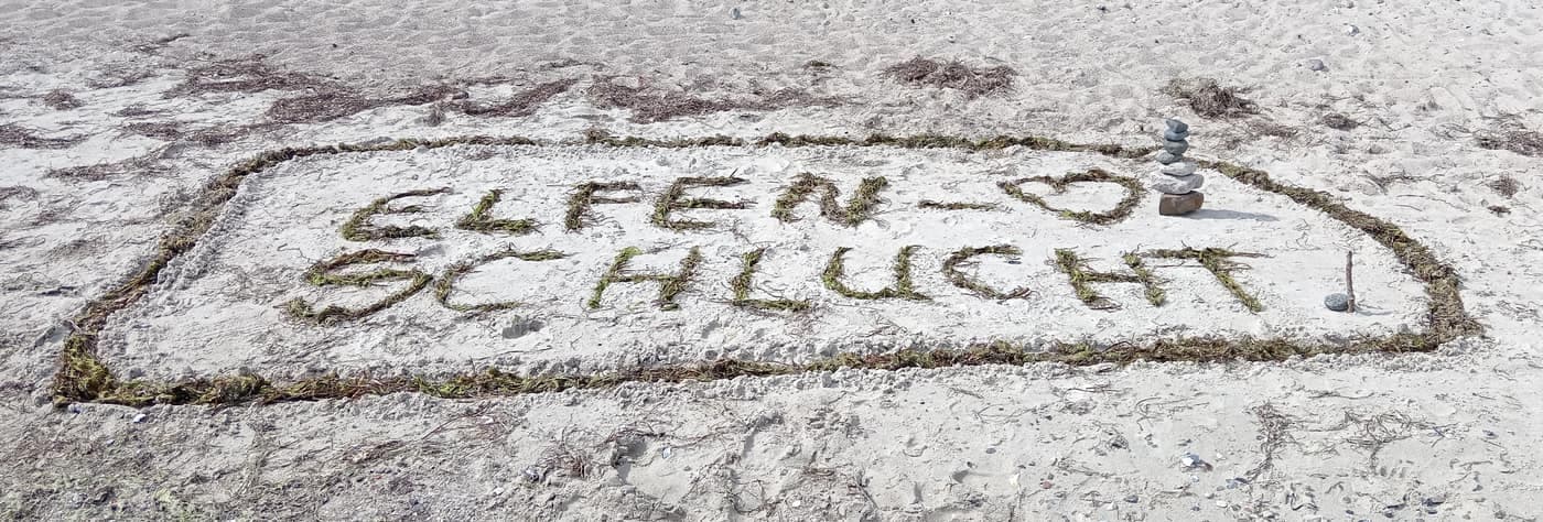 A greeting in the sand